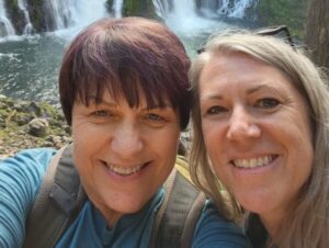 Rebecca Holland and Kimber Olson in front of Burney Falls